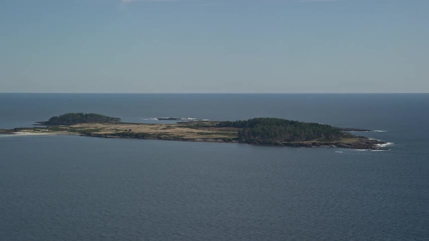 A large uninhabited island surrounded by an immensity of water