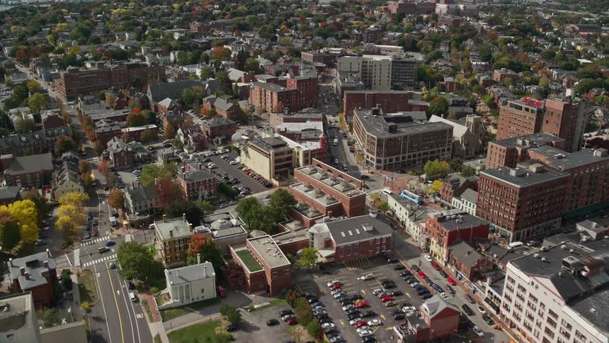 Aerial of buildings and cars in a metropolitan area at midday