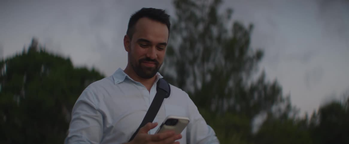 A man talking on his cell phone outdoors