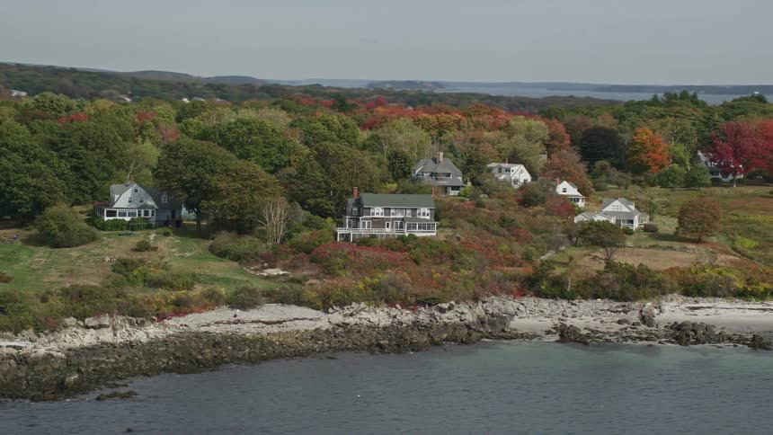 Aerial view of houses by the seaside on an island
