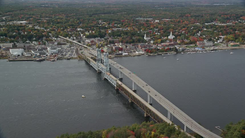 A huge bridge with a road that passes over a river and connects two regions