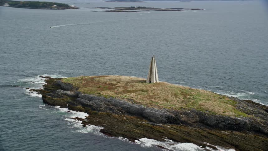A towerlike building on a small and remote island in the ocean