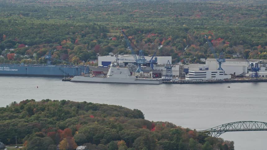 Aerial view of shipping boats on a dock in a lake