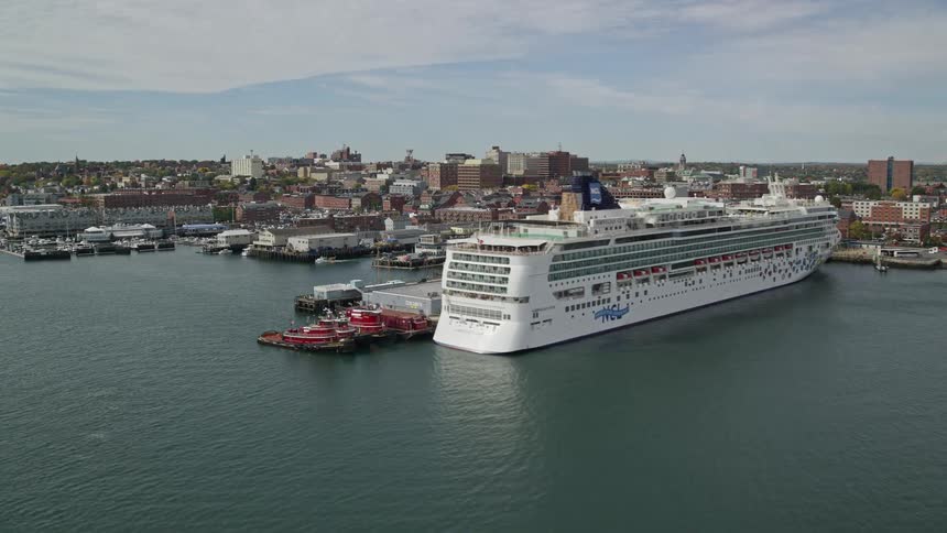 Skyline of the port city with cruise ship docked in the marina