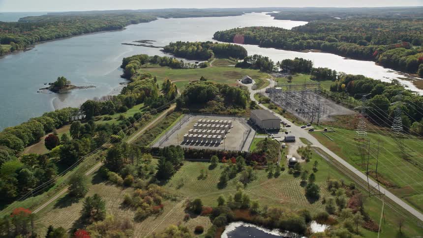 Aerial view of a power station near a river