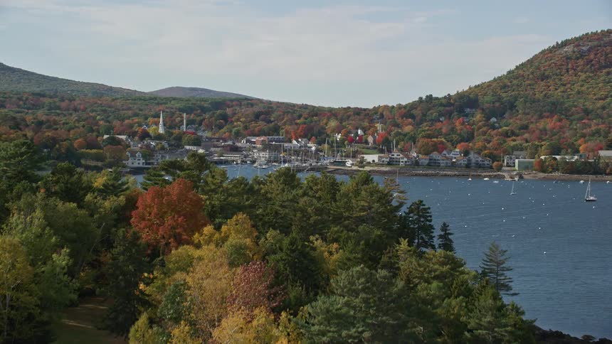 A light house is on the island by the small town