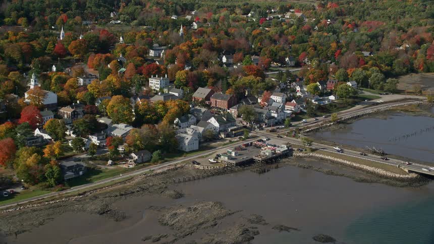 Cars travel on the bridge into the town