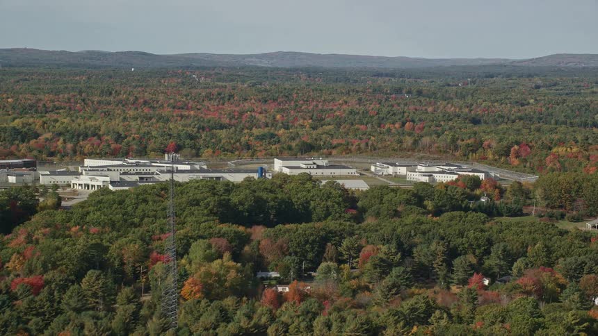 Maine state prison surrounded by a colorful autumn forest in warren