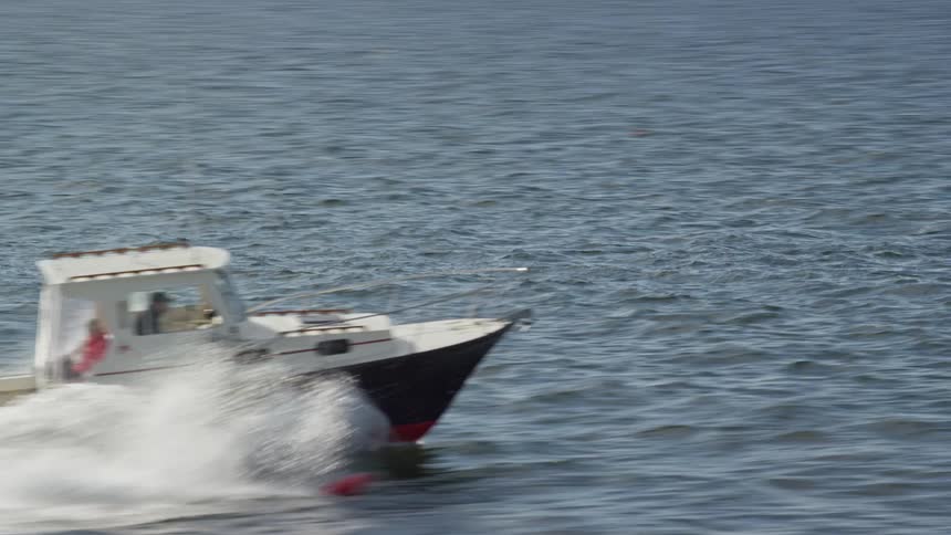 Aerial view of a motorboat on a lake at daytime