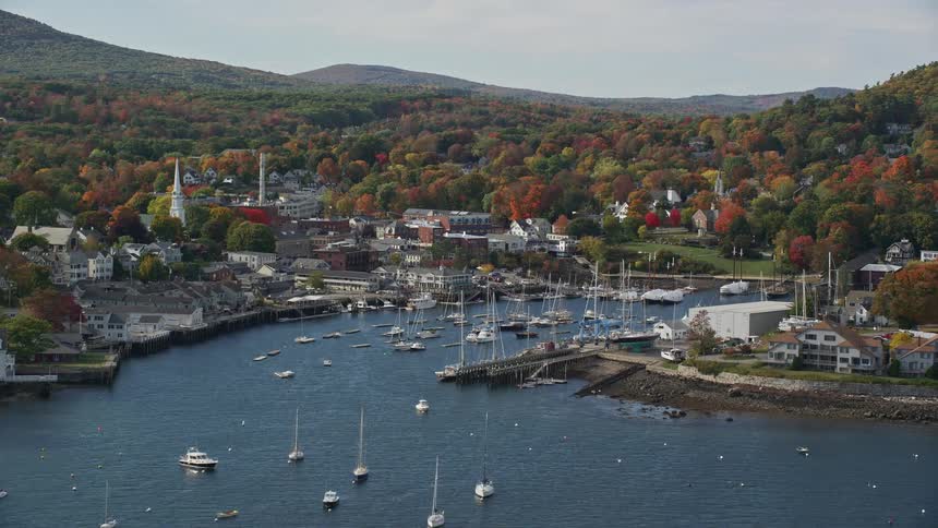 An aerial view of a rural harbor on a river in fall