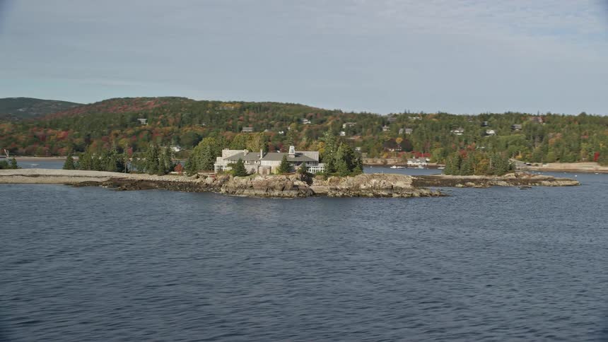 An aerial view of a building closer to the river bank