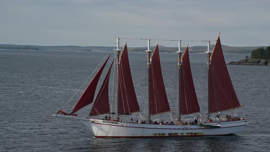 People are riding on a large sail boat