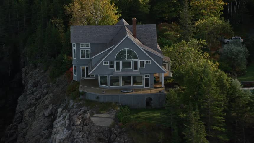 Aerial panorama of a house with modern external architecture by the sea