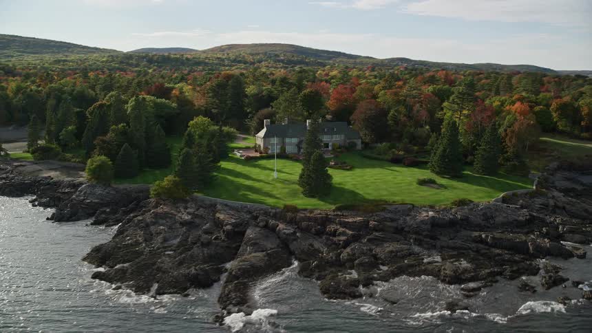 Aerial view of a mansion in the coast of a lake