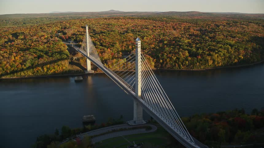 An aerial view of a bridge joining the two banks of a river