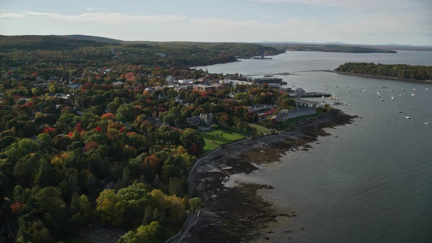 An aerial veiw of a rural habour surrounded by trees in the autumn