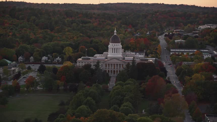 Aerial view of a capitol building on a rural town at evening