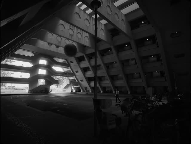 Man walks on the interior of a large structure