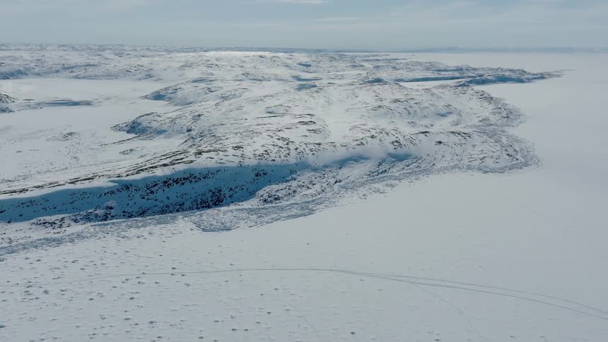 Aerial panorama of the ground covered in snow