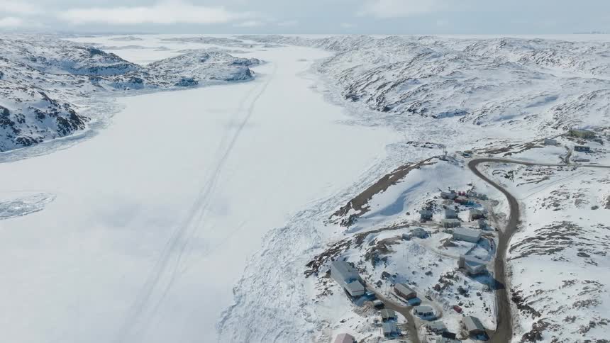 Aerial of a small arctic town during the day