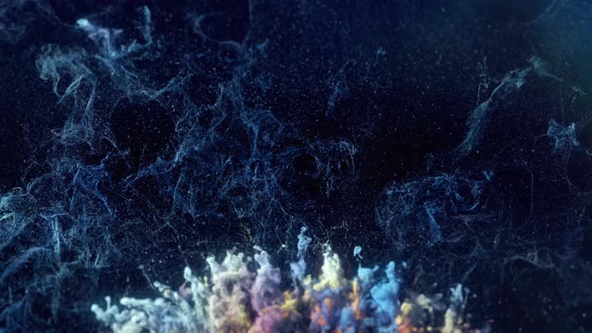 Abstract moving colored smoke on a dark blue background