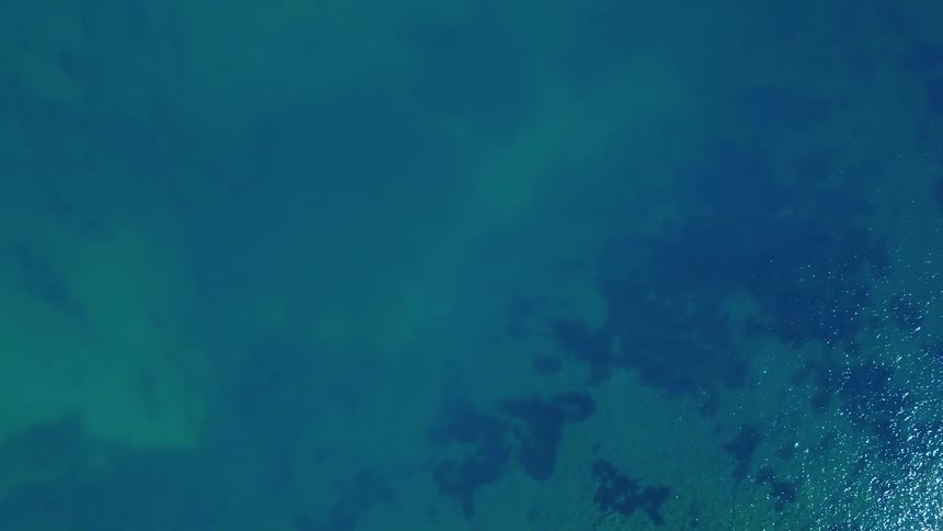 Top down aerial view of clear sea water