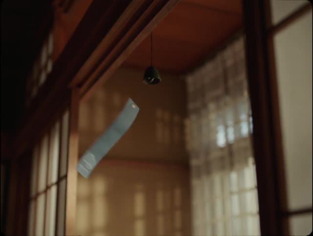 Metal wind chime swinging indoors