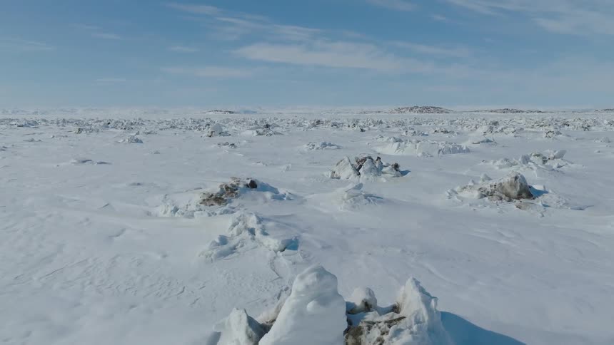 The landscape is covered in ice
