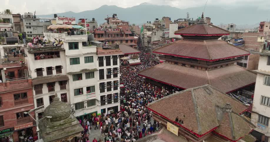 Panorama of a thirdworld city with thousands of people on the streets and balconies