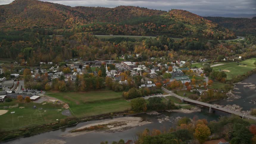 Aerial view of the suburb with houses a river and a bridge
