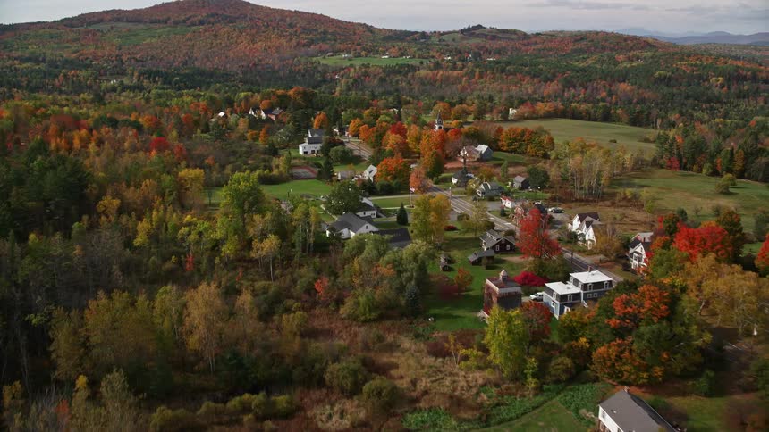 Aerial view of a town in a forested area during autumn