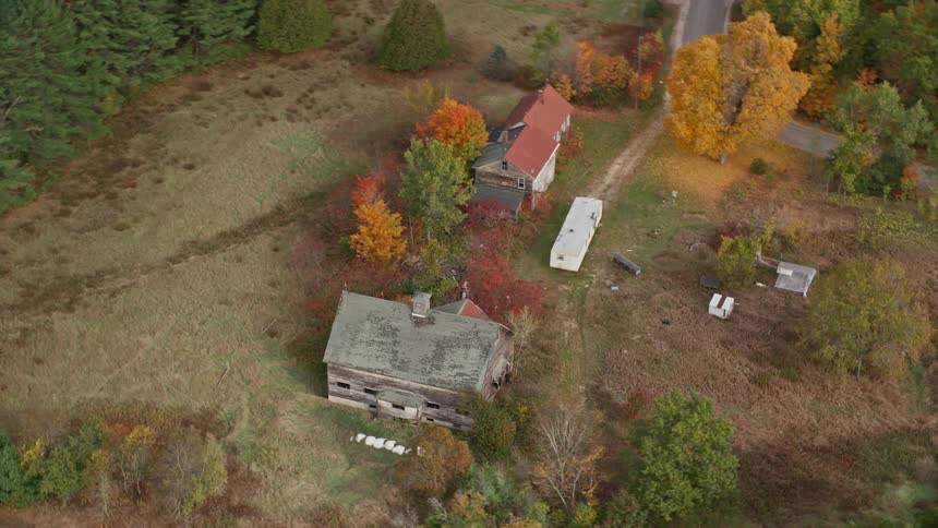Aerial view of a house surrounded by forests in the countryside