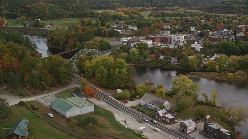 Aerial view of bridge over river fall landscape buildings