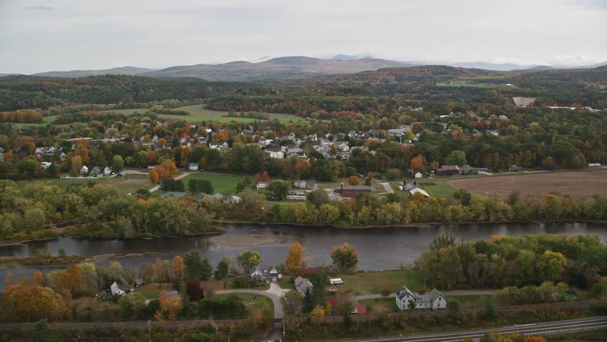 Aerial view of a small town in the countryside next to a river