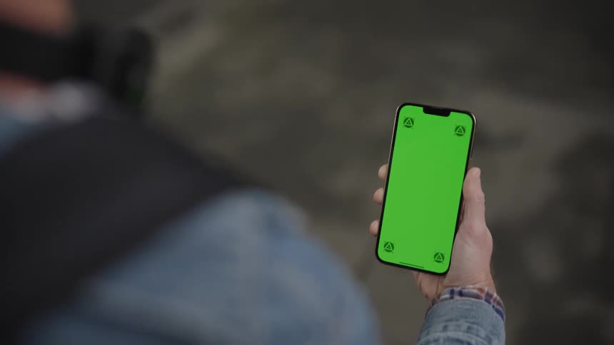 Closeup on a persons hands walking with a cellphone in their hands