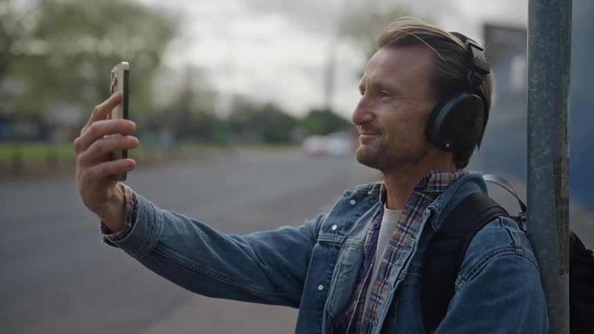 A man on the street talking on his cell phone