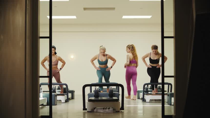 Women following the gym teachers instructions