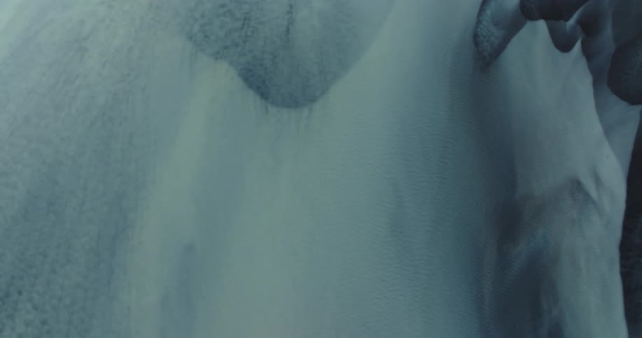 Aerial view of the frozen arctic with ducks on the right