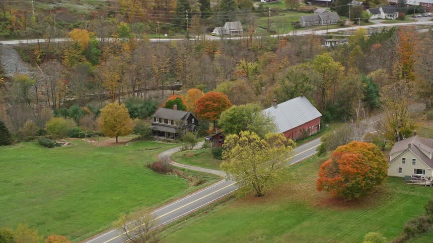 Aerial view of farm house is rural area in fall
