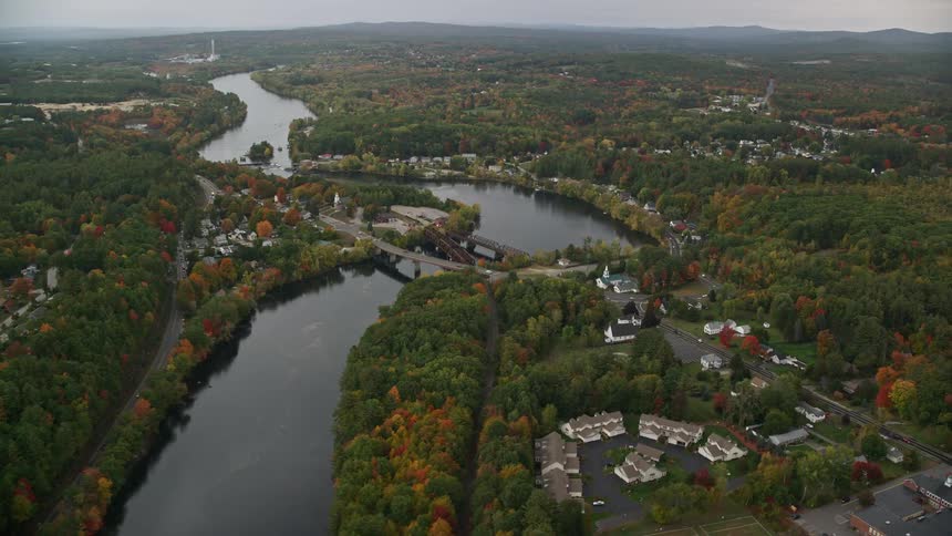 Aerial of a river in a small residential neighborhood