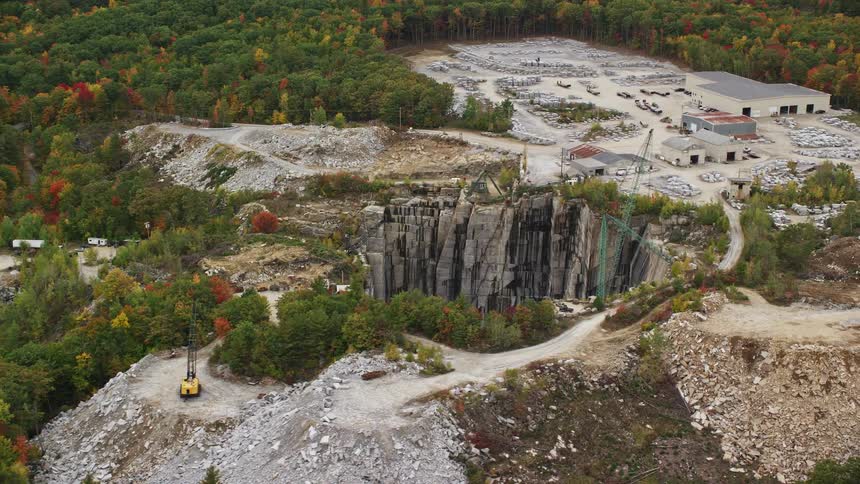 Construction in a crater in the forest during the day