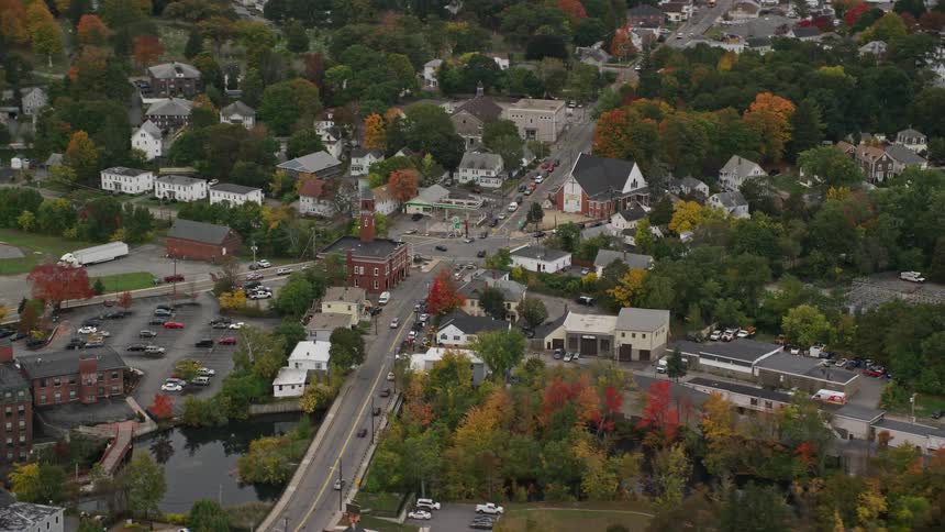 A region of suburbs of a city with a lot of vegetation in the middle