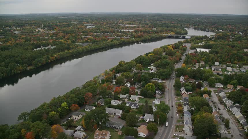 Skyline of an urban neighborhood with a waterway and forest