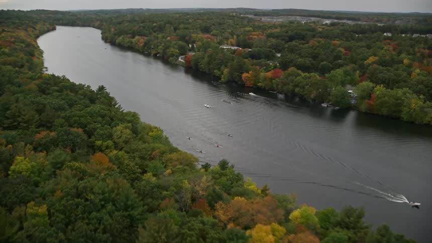 The boats are traveling down the river