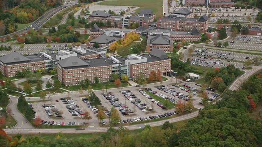 Aerial of a complex of commercial buildings with parking