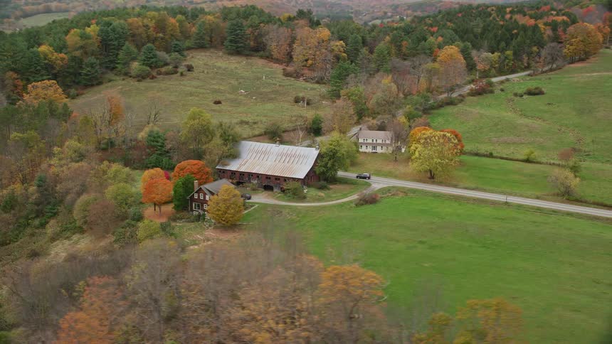 Aerial view of a farm on a hill in the countryside