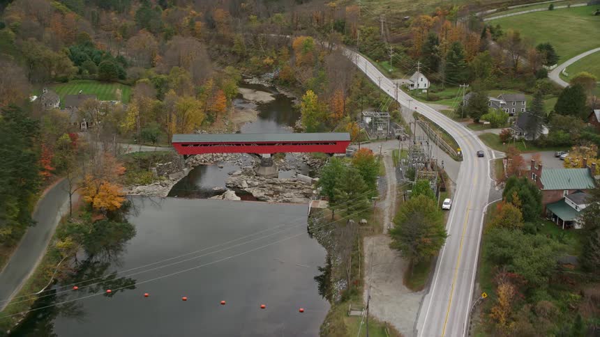 Aerial of a river in a rural town during a cloudy day