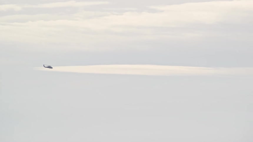A helicopter flying in the sky