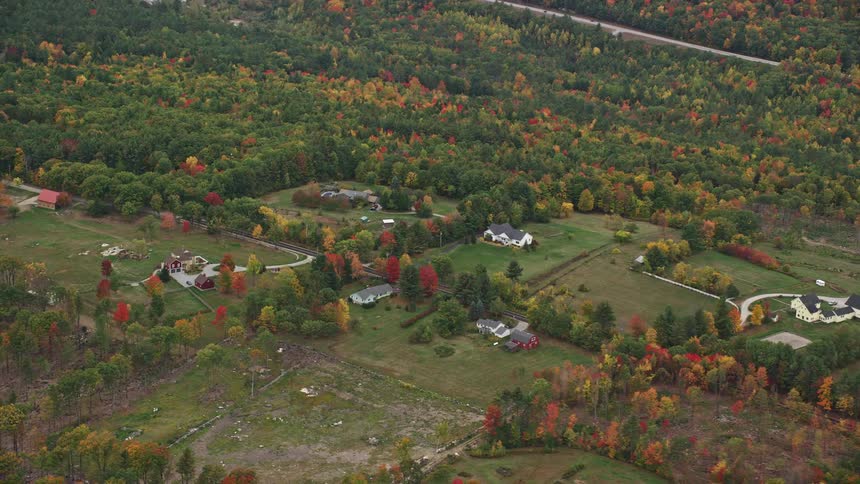 Houses are spaces out far in the woods