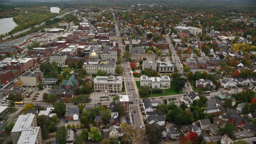 An urban region of a city with many trees spread throughout the city